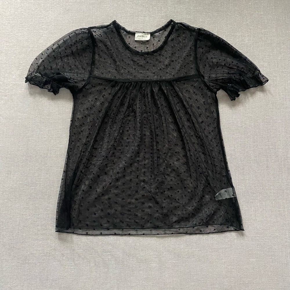 Free Kisses black sheer polka dot top.